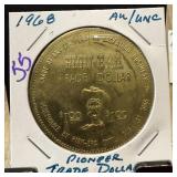 1968 AU PIONEER TRADE DOLLAR