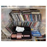 CDs and Rose Gold Microphone