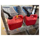 Two Red Plastic Gasoline Containers with Spouts