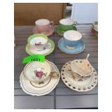 Porcelain Tea Cups and Saucers with Floral Designs