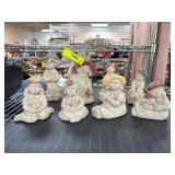 Eight Ceramic Figurines with Painted Hats