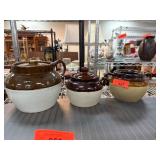 Three Stoneware Crocks with Lids