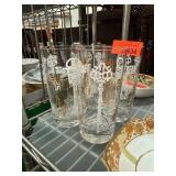 Four Mid-Century Glass Tumblers with Key Motif
