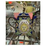 Ceramic Teapot With Sun Motif and Floral Design