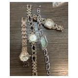 Four Womenï¿½s Wristwatches with Various Designs