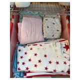 Plastic Storage Bin with Assorted Linens