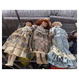 Six Porcelain Dolls in Various Attires