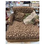 Oversized Chair With Scrolled Brown Upholstery
