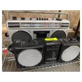 Two Portable AM/FM Stereo Cassette Radio Players