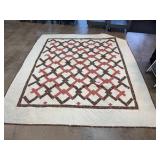 Handmade Patchwork Quilt with Floral Accents