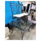 Glass-Top Table With Two Iron Chairs