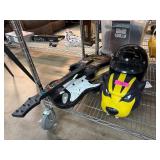 Guitar Hero Controller and Black Motorcycle Helmet