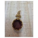 Gold-Tone Pendant with Purple Cameo Design