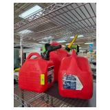 Three Red Plastic Gas Cans with Spouts