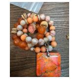 Multi-Strand Beaded Necklace with Orange Pendant