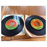 Two 45 RPM Records by Creedence Clearwater Revival