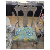 Gray Armchair With Ornate Backrest and Blue Uphols