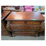 Wooden Chest of Drawers with Ornate Detailing and
