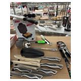 Kitchen Tools Including Knives, Garlic Press, and