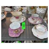 Miniature and Regular Teacups with Rose Motifs