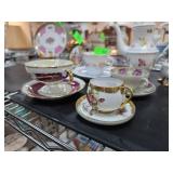 Porcelain Tea Cups and Saucers with Floral Designs