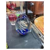 Glass Paperweight With Swirling Design and Blue Ac
