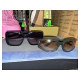 Two Lorvae Sunglasses in Black and Green Frames