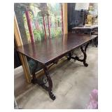Rustic Wood Table With Decorative Iron Supports