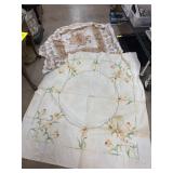 Two Embroidered Tablecloths Needing Cleaning
