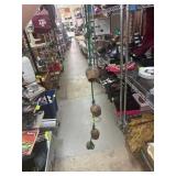 String of Five Metal Cowbells on Green Rope