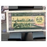 Laos 100 Kip Banknote with Scenic Imagery