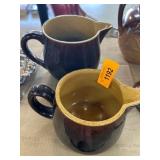 Two Brown Ceramic Pitchers