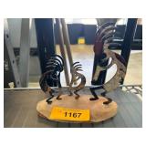 Metal Kokopelli Trio Sculpture on Rock Base