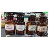 Four Amber Glass Apothecary Jars