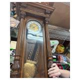 Ornate Wooden Pendulum Wall Clock with Brass Featu