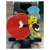 Enamel Pin Featuring Animated Cricket and Apple
