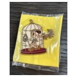 Enamel Pin of Figure in Birdcage Design