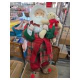 Santa Claus Figure Holding Teddy Bear