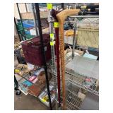 Two Wooden Canes With Carved Handles