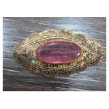 Gold-Tone Filigree Brooch with Purple Stone