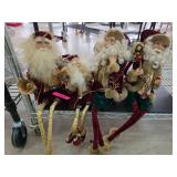 Four Santa Claus Figurines