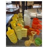 Numerous Tupperware Measuring Cups in Assorted Col
