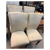 Four Beige Upholstered Dining Chairs