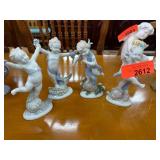 Four Arco Porcelain Cherub Figurines