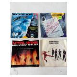 Four 7-Inch Vinyl Singles