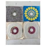 Four 7-Inch Vinyl Records with Sleeves