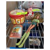 Collectible Doll, Tin Box, Card Deck, and Ceramic