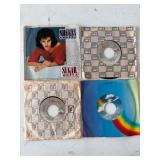 Four 7-Inch Vinyl Records