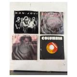 Four 7-Inch Vinyl Records