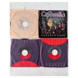 Four 45 RPM Vinyl Records